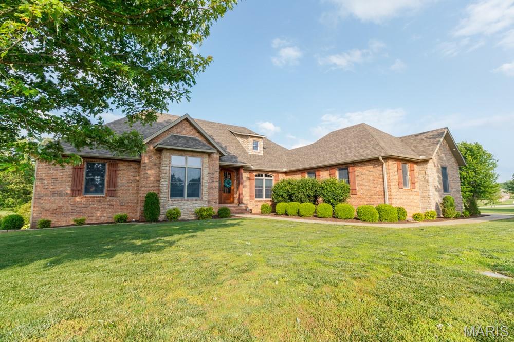 WELCOME TO CASTLE ROCK ESTATES !! THIS QUALITY CUSTOM BUILT BRICK & STONE, OVER 5400 SQ FT of LIVING space. FULL WALK OUT BASEMENT. This SPACIOUS home offers 5-6 BEDROOMS, 3 1/2 BATHS, 3 BEDROOMS 2 BATHS on the MAIN LEVEL, LARGE KITCHEN w/ GRANITE COUNTERS, DOUBLE OVENS, STAINLESS APPLIANCES. A HEARTH ROOM with STONE GAS LOG FIREPLACE. THE MAIN LEVEL LIVING, KITCHEN, FOYER, FORMAL DINING ROOM, HEARTH ROOM all have HICKORY HARDWOOD FLOORS. LARGE REAR COVERED PORCH. THE MASTER SUITE HAS  RECENTLY UPDATED THE BATHROOM,  IT OFFERS A FIREPLACE, LARGE WALK IN CLOSET  NEW CUSTOM SHOWER, The lower level offers the FAMILY ROOM, WET BAR W/ A FRIDGE, wired for A RANGE. VERY LARGE MASTER SUITE, W/CROWN MOLDING & BACKLIGHTING, JETTED TUB, WALK IN SHOWER, LARGE CUSTOM CLOSET, and a FIREPLACE. THE LOWER LEVEL OFFERS HAS NEWER LVP FLOORING,  Extra LARGE BATH w/DOUBLE VANITY and the 2ND LAUNDRY ROOM. 2 OVERSIZED BEDROOMS, EXERCISE ROOM, HUGE HOME THEATRE ROOM, John Deere ROOM. LARGE PRIVATE FENCED REAR YARD, OVERSIZED SIDE ENTRY 3 CAR GARAGE. STORM SHELTER ROOM. A CUL DE SAC OFFERING ADDITIONAL PRIVACY ......MAKE YOUR APPOINTMENT TODAY !