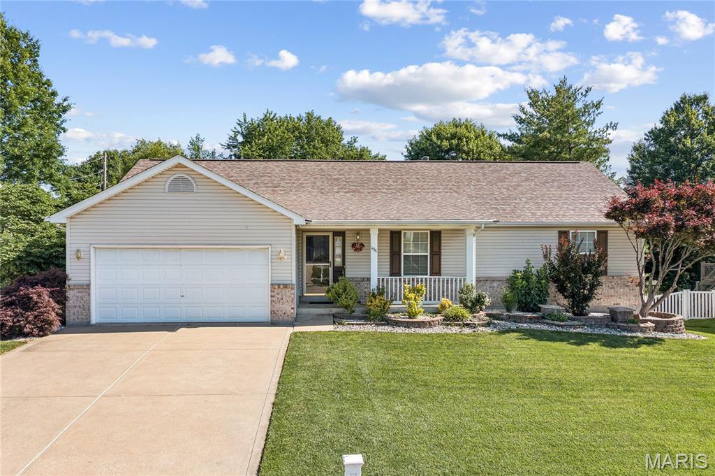Welcome to this beautifully maintained, 3-bedroom, 3-bathroom ranch, complete with an attached 2-car garage. A manicured front lawn and an inviting front porch creates exceptional curb appeal. Step inside to a spacious living room featuring a vaulted ceiling, cozy fireplace, and brilliant natural light from strategic skylights and lots of windows. The open-floor plan seamlessly flows with gorgeous hardwood flooring throughout the main level. The large kitchen is complete with stainless steel appliances, a center island, ample cabinetry, and generous countertop space. The master suite, which features dual sinks, a separate soaking tub and shower, and a walk-in closet. Two spacious bedrooms and a 2nd full bath provide plenty of space for family or guests. The extra-large lower-level recreation room features bright tile flooring, abundant windows, and a sliding door leading to the backyard. Two additional basement bedrooms provide the perfect layout for a home office or guest, alongside a third full bathroom. Step outside to an impressive, spacious covered deck, it’s perfect for morning coffee or summer family barbecues. The stunning, fully fenced backyard features professional landscaping that creates a private area for family gatherings.