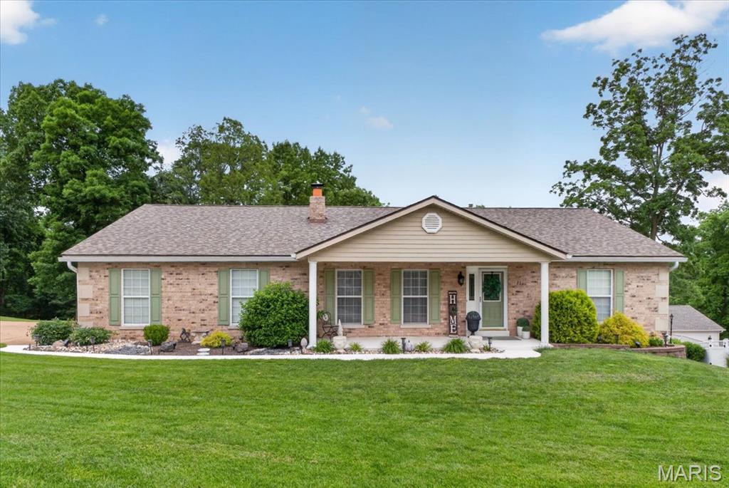 Welcome to 21 Christina Dr, a stunning atrium ranch with a park-like yard that backs to a lake! This beautifully updated home features an open and airy atrium ranch floor plan with soaring cathedral ceilings, rich hardwood flooring, and an abundance of natural light throughout. The spacious great room is highlighted by a striking floor-to-ceiling brick fireplace with custom built-ins, creating the perfect gathering space. The heart of the home opens seamlessly into the dining area and updated kitchen, showcasing white cabinetry, stainless steel appliances, and generous prep space ideal for entertaining. The signature atrium fills the home with natural light and brings the outdoors in, while the peaceful backyard setting overlooks the lake for year-round scenic views. Currently there are 2 bedrooms on the first floor, as the primary bedroom closet was converted from a bedroom to a closet, but could be easily transformed into an additional 3rd bedroom on the main floor. The partially finished basement provides and additional bedroom and full bathroom with plenty of space to finish to your liking. Whether relaxing by the fireplace, hosting guests, or enjoying your morning coffee with lake views, this home offers the perfect blend of comfort and charm!
