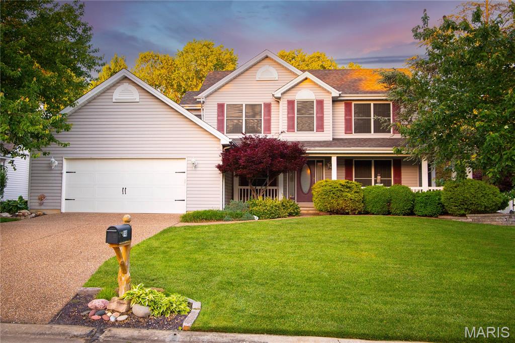 Welcome to this spacious 1½-story home, offering the best of both worlds — strong value for a generous amount of square footage, plus the opportunity to make it truly your own with cosmetic updates. With 4 bedrooms, 2.5 baths, approximately 2,436 square feet, and a desirable layout, this home is full of potential.

A wrap-around covered front porch leads into a hardwood-entry foyer flanked by a formal dining room. The vaulted great room features a floor-to-ceiling brick fireplace, a large bay window, and views of the backyard. The kitchen offers abundant cabinetry, a center island, planning desk, pantry, and an adjoining breakfast room with access to the patio.

The main-floor primary suite includes a vaulted ceiling, bay window, walk-in closet, and private bath with a separate tub and shower. Upstairs are three additional bedrooms and a full hall bath, providing plenty of room to spread out.

The lower level offers additional possibilities and has recently benefited from professional waterproofing improvements by Woods Basement Systems, including a drain tile system and battery-backup sump pump system. Outside, enjoy a fenced backyard, patio space, mature landscaping, and an irrigation system. The 25-foot-wide garage is not quite a true three-car, but it is a nicely oversized two-car garage with valuable extra width for storage, bikes, tools, or a workshop area.