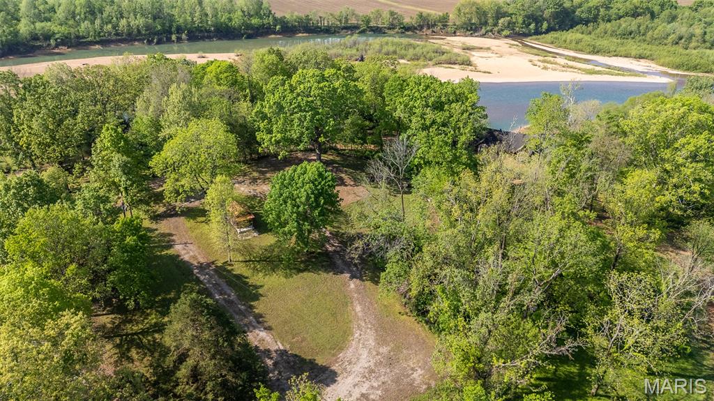 Private Boat Ramp Access • Current River • No Flood Risk • 3 Campsites • Minutes to Doniphan

Hard-to-find Current River access property featuring private boat ramp access shared by only a small group of owners (approx. 5–6)—offering convenient entry to the river without the crowds.

Even more rare, this property sits outside of the flood zone, allowing you to enjoy the river lifestyle with added peace of mind.

This level, build-ready parcel is already improved with three established campsites, making it ideal for immediate use while you plan your future build, or perfectly suited for a family compound or multi-cabin setup.

Property improvements include a gravel driveway, newer electrical service (within the last 3 years), and a septic system less than 5 years old that has never been used—providing a strong foundation for future construction.

A standout feature is the partially finished utility building, originally designed as a well house, with space for a washer and dryer and plumbing already in place for future shower/bath facilities to support the campsites. Simply add a well to complete the setup.

Located just minutes from Doniphan, this property offers the perfect combination of accessibility, privacy, and usability.

Whether you're looking for a weekend retreat, RV setup, or future build site, this property delivers flexibility, convenience, and long-term potential.