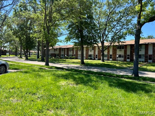 Only In The Good Ole USA Can You Find A Home For Under $50K!  The Hazelcrest Grounds Are Very Pretty, A Park Like Setting w/Mature Trees, Wide Streets and Plenty Of Parking!  This Is A Ground Floor Unit With An Entry Foyer, All Electric, Coin Operated Laundry Facility, Assigned Parking and A Semi Private Backyard From Your Patio!  3 Bedrooms, Updated Bath and Six Panel Doors!  The Kitchen Is Large and Has A Breakfast Bar!  As You Can See By The Pictures, A Fresh Coat Of Paint and Flooring Will Easily Transform This Into Your Own Sanctuary!   Don't Let A Few Minor Changes Keep You On The Sideline!  The Monthly Association Fee Covers Your Water, Sewer, Trash, Lawn Care and Snow Removal! In Addition, Those Small Monthly Dues Also Pay For Parking Lot and Exterior Maintenance!  Collectively, Hazelcrest Just Replaced The Roofs Last Year!  No Rentals!  Selling In As-Is Condition!  No Warranties, Guarantees, Inspections or Disclosures Provided!  Seller Has Never Occupied Property and Has No Knowledge Of Condition!  Seller Reserves The Right To Negotiate Multiple Offers Regardless Of Date/Time Received!  Seller Reserves Up To 20 Days For Contract Acceptance!  Final Sale Is Subject To MO Probate Court Approval!  Please Use Special Sale Contract and Include Proof Of Funds Along w/Minimum $1200 Earnest Money!