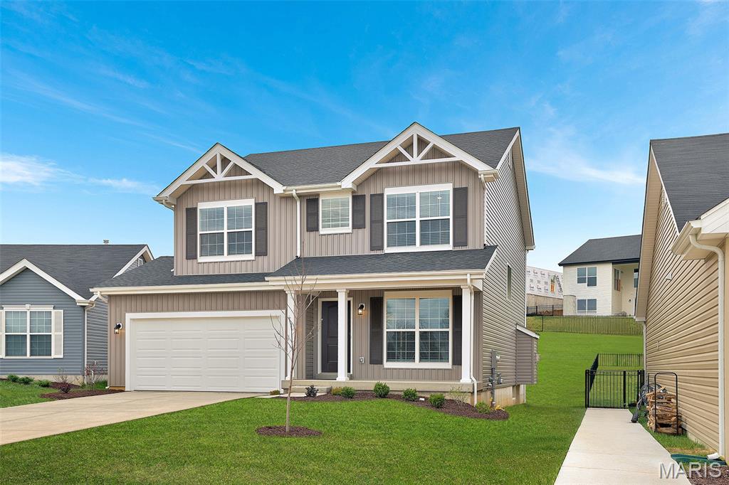 New McBride Homes Sterling floor plan w/4BR 2.5BA is ready now! The main floor has wood laminate flooring & 6’ windows. Off the foyer, you’ll find a large living room, plus a large family room adjacent to the dining area & kitchen. The expanded kitchen has an island, quartz countertops, with Winstead Burlap 42” cabinets, pantry, & stainless GE appliances. The dining area has a sliding glass door that leads to the backyard. Half bath completes the main floor. Upstairs you’ll find the primary suite w/walkin closet, a private luxury bath with shower & roman tub, dual vanity & linen closet. 3 extra bedrooms share a full bath add convenience. Bedrooms 2 & 3 feature walk-in closets. Upstairs laundry. Winding Bluffs Addition offers new homes in the Fenton area, minutes from Gravois Bluffs. Amenities include a pickleball court, athletic field, dog park, trails, & community lake. Enjoy peace of mind with McBride Homes’ 10yr builders’ warranty & incredible customer service! Similar photos shown.