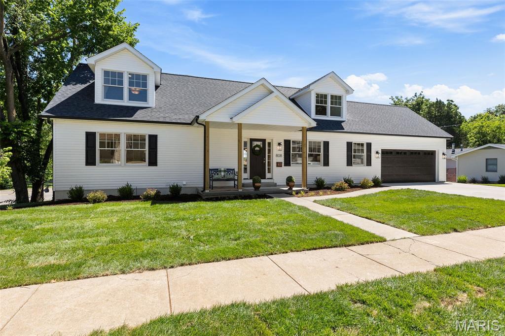 Welcome to this beautiful newer home in Crestwood! Thoughtfully designed and impeccably finished, this Cape Cod-style home offers the perfect blend of style, comfort, and easy living. The open floor plan creates an inviting atmosphere, highlighted by gorgeous engineered wood flooring and tasteful designer touches throughout.

The living room is a cozy spot to enjoy your morning coffee, gather with friends, or unwind at the end of the day. At the heart of the home, the kitchen combines function and style with a striking navy island, crisp white cabinetry, stone countertops, stainless steel appliances, and plenty of space for everyday living and entertaining.

Just off the kitchen, the spacious laundry and mudroom features charming wallpaper and serves as the perfect drop zone from the attached two-car garage. The main-floor primary suite—a rare and highly desirable feature—offers two walk-in closets and a spacious ensuite bath. A second main-floor bedroom and full bath provide flexibility for guests, family, or a home office.

Upstairs, a versatile loft area is ideal for homework, reading, play, or additional lounge space. Two generously sized bedrooms and a full hall bath complete the upper level.

The walkout lower level is filled with natural light and offers exceptional additional living space, including two large recreation areas, abundant storage, and a fourth full bath—perfect for entertaining, hobbies, fitness, or movie nights.

With beautiful finishes, a functional floor plan, and spaces designed for both everyday living and gathering with family and friends, this home truly has it all. Welcome home!