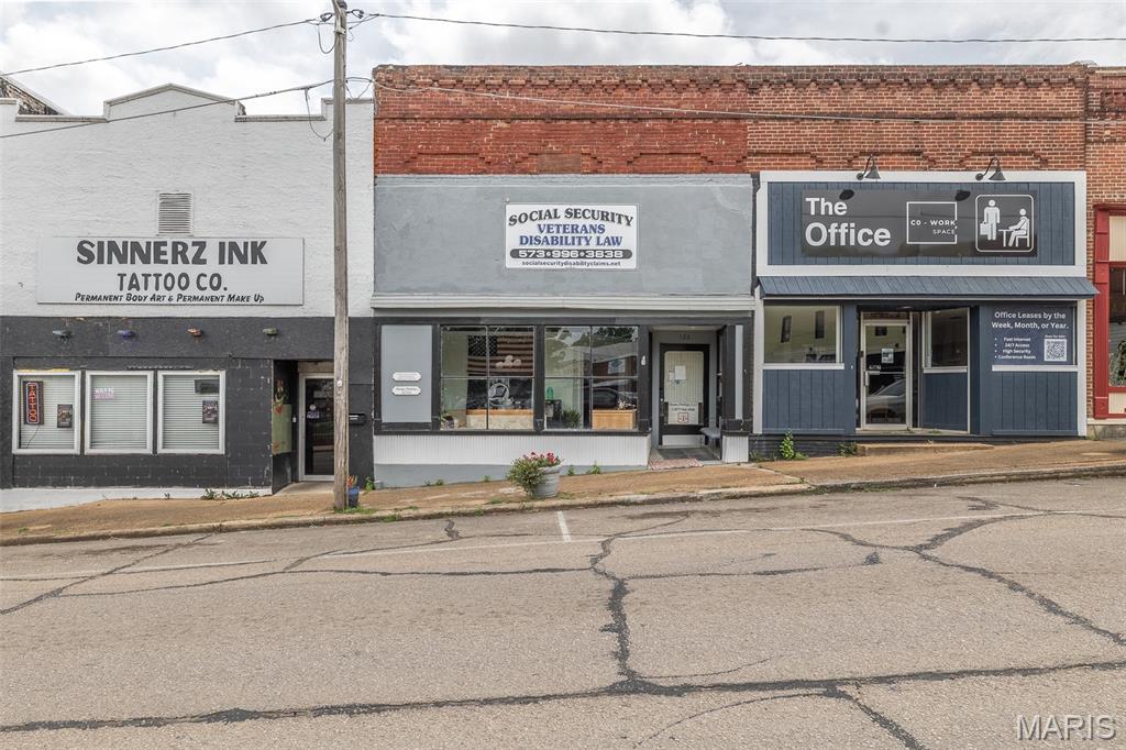 128 Washington Street, Doniphan, Mo 63935
$159,900
2750 SQFT

This Property is located in downtown Doniphan, Mo, making this a versatile commercial property. The office area offers three offices, a waiting room, a small conference room, and a half bathroom with additional plumbing outside of the bathroom for added options for a sink or a coffee area. This Building also includes a separate apartment complete with a bedroom, full bathroom, kitchen, utility closet, and a pellet stove, making it ideal for an owner occupant, employee housing or additional rental income. With central heat and air provides year round comfort throughout the property. Whether you are expanding your business or looking for an investment opportunity, this property offers the space and flexibility to fit variety of commercial uses that you are looking for!