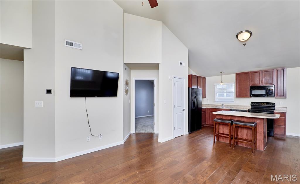 You've earned a home that works for you - not the other way around. This beautifully maintained 2-bedroom, 2-bath condo in O'Fallon offers the space you want without the yard, the roof, or the to-do list.

Step inside and you'll immediately feel the care that's gone into this home. Warm hardwood floors, updated tile, and fresh carpet - all done within the last two years - give every room a clean, polished feel. The open layout makes daily living easy and comfortable, with room to host family when they visit.

The deck off the living room is a quiet spot to enjoy your morning coffee or an evening with a good book. Covered parking protects your car year-round without you lifting a finger. All major appliances -refrigerator, washer, dryer - are included, so the transition is as smooth as possible.

HOA handles exterior maintenance and grounds, so your time is truly your own. You're minutes from shopping, medical offices, restaurants, and parks - everything within easy reach in one of St. Charles County's most convenient communities.

Low-maintenance living at its best. Come see it for yourself - we think you'll feel right at home.