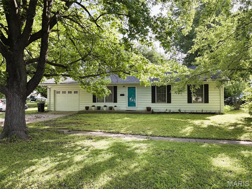 Spacious ranch home in the heart of town! Features include 3 bedrooms, 2 baths, with split bedroom design. Master suite was added on to the rear of home that boasts vaulted ceilings, dual closets, master bath, and door out to the patio and back yard. The original 2nd & 3rd bedrooms were combined to make another large bedroom with dual closets as well. Leaving the home with 3 good sized bedrooms. Other features include, living room with hardwood floors, laundry/utility room, kitchen with oak cabinets and stone backsplash, and oversized one car garage. All this setting on a nice sized corner lot with additional parking and large shade trees.