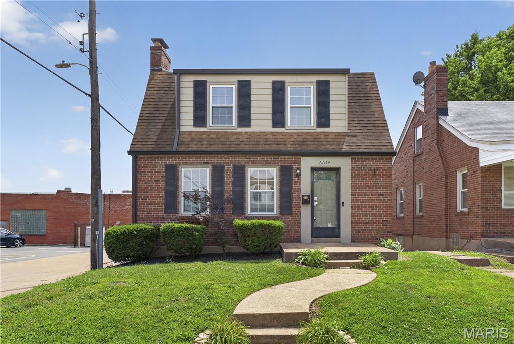 Charming two-story brick home in the desirable Southwest Park Addition of South St. Louis City. Built in 1939, this traditional residence offers 3 bedrooms, 1 full bath, and 1 half bath across 1,596 square feet of living space. The inviting interior features beautiful hardwood floors, an open floor plan, spacious living room, separate dining room, and a well-appointed kitchen with custom cabinetry, center island, pantry, eat-in area, and ceramic tile flooring. All three bedrooms are located on the upper level and feature hardwood flooring. The partially finished lower level provides additional living and recreation space, complete with a wood-burning fireplace, making it perfect for entertaining or relaxing. Additional highlights include an entrance foyer, insulated windows, window treatments, and ample storage. Situated on a level lot near public transportation, this home offers off-street parking and convenient access to shopping, dining, parks, and major commuter routes. Enjoy the comfort of central air, forced-air natural gas heat, public water, and public sewer services. A wonderful opportunity to own a classic South City home blending timeless character with modern functionality.