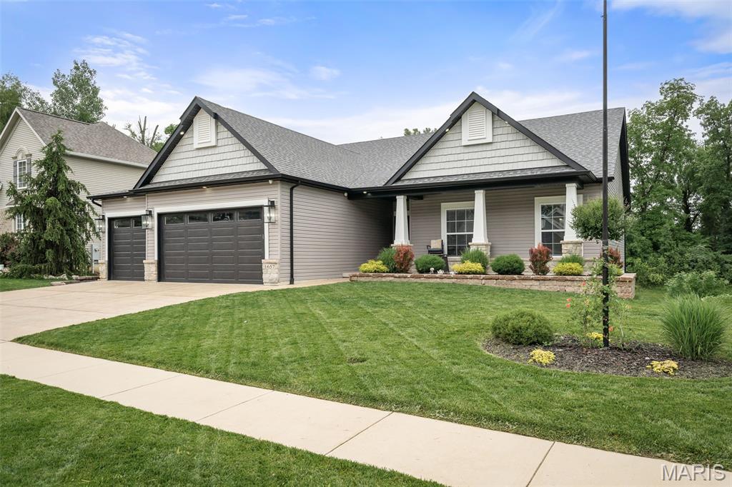 **Open house Sunday July 12th 12-2pm**  Welcome to 1657 Westlake CT, Pacific MO 63069, a turn-key single-family residence constructed in 2022. Located in the Villages of Westlake with private lake, pool, and cabana for neighborhood residents to enjoy. The heart of this home is an open-plan eat-in kitchen, seamlessly integrated with the living room. It features high ceilings, sleek stone counters, and a central island with a built-in farm sink, all complemented by high-end stainless-steel appliances and a premium range. The living room itself elevates the experience with its vaulted ceilings and centerpiece gas fireplace with custom mantle and stone hearth. Built in Bluetooth home stereo system features speakers in living room, garage, and front porch. The primary bedroom offers the convenience of an ensuite bathroom and walk-in closet providing a private retreat.   The second and third bedrooms feature walk in closets and share a full bath. The fourth bedroom comes complete with built in Murphy bed/armoires and office desk making great use of the space. Additional features enhance daily living, including a dedicated laundry room with built in cabinetry, custom hall trees, an attached, oversized, and insulated three-car garage, and permanent outdoor holiday lighting. Enjoy the outdoors on the inviting back patio or front porch, both perfect for evening gatherings! Schedule your private viewing today.
