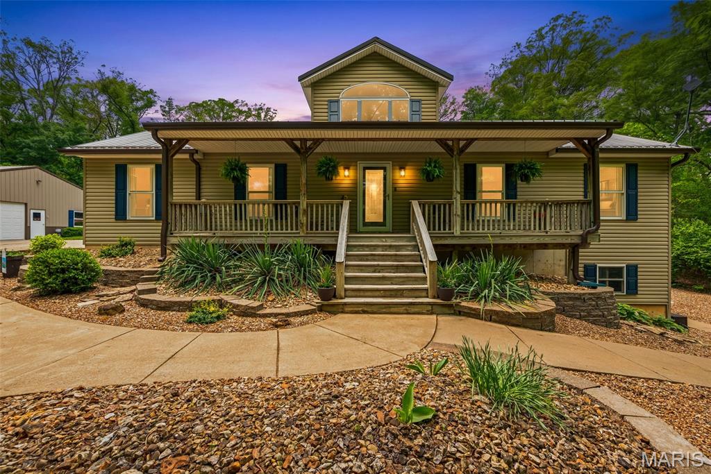 This stunning 3-acre lot is a serene retreat with mature trees and a heated inground pool.  Enjoy evenings by the fire pit or explore cleared trails for hiking and four-wheeling.  The property includes a detached workshop, two covered patios, and a new metal roof and gutters (2021).  Inside, there are 3 bedrooms and 2.5 bahtrooms, featuring an updated kitchen and bathrooms with modern appliances, granite countertops and heated floors in the master bath.  The finished basement offers a game room, wet bar and flexible space for a home office or gym.  This well-maintained home is perfect for comfort and tranquility.