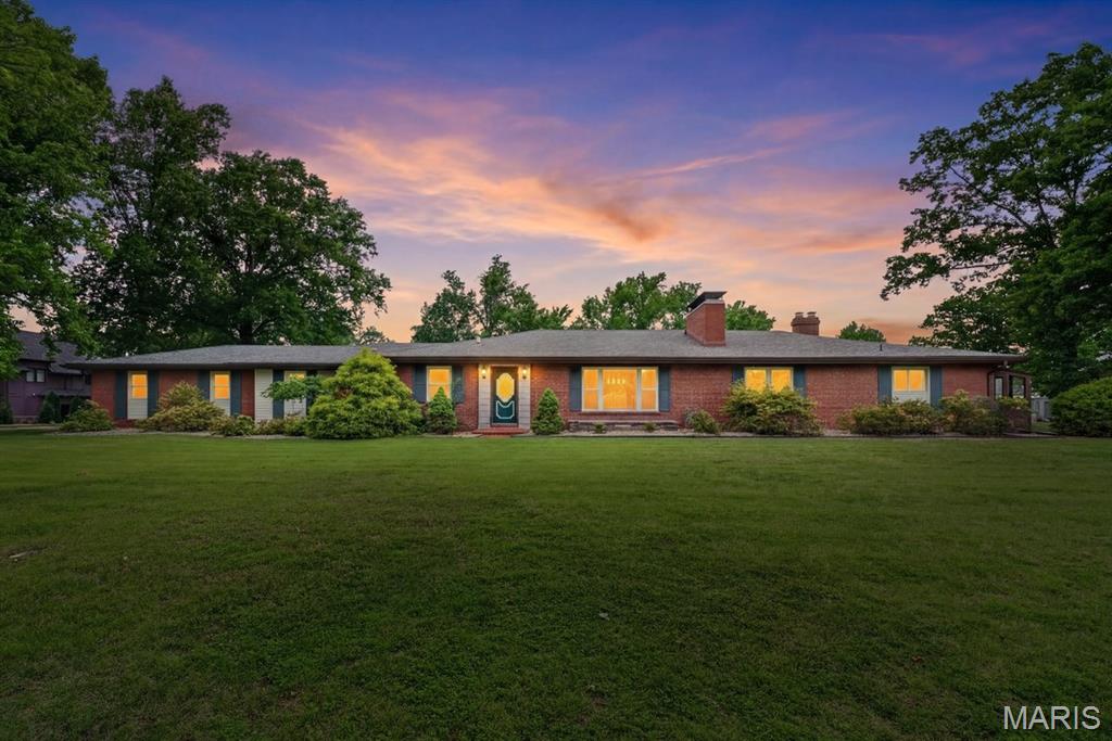 Tucked away on a breathtaking stretch of acreage in the heart of Kirkwood, this truly exceptional retreat is nestled on a sprawling, private corner lot! Surrounded by mature trees, lush landscaping, and elegant outdoor lighting, this remarkable estate offers the perfect blend of timeless character, modern comfort, and resort-style living.
The backyard oasis is nothing short of spectacular, centered around a stunning in-ground pool resurfaced just three years ago. Designed for unforgettable summers, the pool features a slide, diving board, and an impressive 10-foot deep end, creating the ultimate space for entertaining and relaxation. Enjoy evenings under the glow of custom uplighting while listening to the built-in outdoor sound system or watching your favorite game on the outdoor TV all of which stay with the home. A drip irrigation system around the pool keeps the landscaping vibrant and beautiful with ease.
Inside, the home showcases gorgeous original hardwood floors, three fully working fireplaces, and beautifully remodeled living spaces filled with warmth and sophistication. The inviting sunroom just off the kitchen creates the perfect setting for morning coffee or peaceful evenings overlooking the private backyard retreat. An expansive awning adds additional comfort and shade for outdoor gatherings year-round.
Designed with both elegance and convenience in mind, the home also includes a hardwired security system, two separate driveways for added accessibility and guest parking, and a thoughtfully designed bar area complete with a mini fridge and ice machine that remain with the property. The washer and dryer are also included, making this home truly move-in ready.
Every detail of this extraordinary property has been curated to deliver an elevated lifestyle rarely found in such a coveted St. Louis location!
