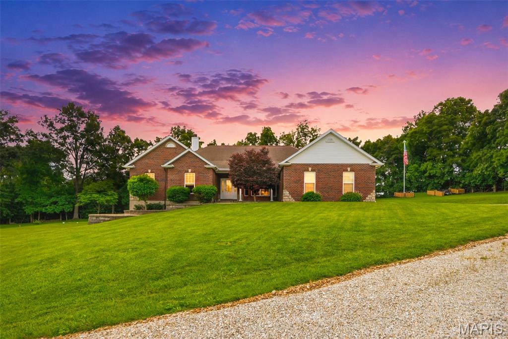 This is an incredible must see full brick front custom home on 2.3 acres located in back of subdivision on wooded cul de sac lot-lots of wildlife! Gourmet kitchen with beautiful custom cabinets, bay window, granite counter tops, pantry and walks out to covered patio! 3 bedrooms, and 2.5 bathrooms-vaulted ceilings-separate dining room-stone floor to ceiling woodburning fireplace and wall of windows in living room-french doors to enormous master bdrm plus a luxury bathroom with dual sinks, garden tub and separate shower-MFL-full walkout basement with large windows, r/i plumbing and ready to be finished-3 car oversize drywalled/insulated garage-yearly HOA dues are $400 per year than $20 per month for water-Gateway Fiber