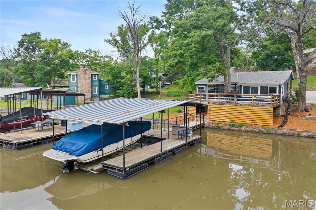 Experience premier lakefront living at its finest in Sunrise Beach, MO! This charming, recently updated cabin is perfectly tucked
into a serene, deep-water, no-wake cove near the iconic Hurricane Deck Bridge at the 35 MM, offering the ultimate blend of privacy and convenience. Inside, sophistication meets comfort with fresh flooring throughout, new interior and exterior paint, brand-new countertops, a new dishwasher, beautifully renovated bathrooms, highly efficient new mini-split systems providing year-round
comfort, and a brand-new septic system for total peace of mind. Step outside to enjoy your private dock boasting year-round deep water, making it absolutely ideal for swimming, boating, and lakeside relaxation. Location is everything; you are just minutes from popular restaurants, entertainment, and gas stations--seamlessly accessible by land or water in any direction. This turnkey
home comes fully furnished, and nightly rentals are permitted, offering incredible versatility. Whether you seek a weekend retreat, a full-time lake residence, or a lucrative investment property, this turnkey gem checks every single box. Call today to schedule your private showing! Check out the virtual tour!