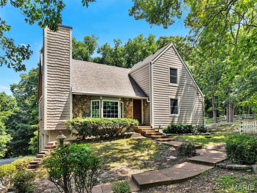 Welcome to this 1.5 Story home on 3 acres that backs up to your own personal view of Greensfelder Park! If your not familiar Greensfelder Park has some of the best hiking trails for people, pets, and horses (14.5 miles), plus a challenge courses and Alpine tower for the kiddos! This home is being sold as-is. It is an estate home for sale and limited information is known about the property.  As you walk-in please take notice of the beautiful wood plank cathedral ceiling in the great room. Off the great room is a large deck that is need of repair. Main floor has primary bedroom and one bathroom on the main level. The kitchen is so spacious with plenty of kitchen cabinets, counter top space, and a large pantry with two other small closets. Off the kitchen is a large screened in porch waiting for a little TLC. Upstairs you will find two other bedrooms and another bathroom. In the basement is the fourth bedroom and half bathroom. The balance of the lower level could be for a game room and storage. It is so quiet and peaceful and room for the kiddos to play outside. There is work to be done to this home but your rewards will be amazing!