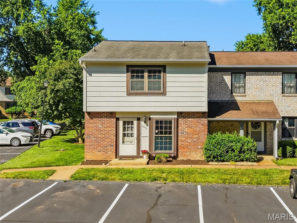 End unit townhouse is situated close to everything but tucked in a private enclave surrounded by trees. This is the largest floorpan in the complex with 3 bedrooms, 3.5 baths, and finished LL with office/sleeping area and recreation room. Kitchen has been remodeled with 42 inch white shaker cabinets, SS appliances, & doorways enlarged for a spacious feel. Formal dining room has space for a large table to entrain friends or have game nights. Family room and adjacent breakfast room give you lots of room to spread out. Upstairs is the primary suite with attached bath & walk-in closet with organization system. 2 additional bedrooms, 2nd full bath, and large linen closet complete the upstairs. Lower level has an office/sleeping area, recreation room for 2nd TV room or gaming area, Laundry room with storage, and a full bath. Backyard has the option to be fenced if desired. This unit has 2 assigned parking spots right in front of the home. Other: newer LVP floors, MF bathroom update, popcorn ceilings removed, & all appliances can stay with the unit. HOA amenities include a pool, tennis court, basketball hoop, and clubhouse. The monthly fee covers water, sewer, trash, and exterior maintenance.  Ideally located near restaurants, shopping, and Queeny Park, with easy access to Highways 270, 141, 40, and 44, this home offers both comfort and convenience in a highly desirable area. Updated photos will be added in the next 1-2 weeks this are from before renovations were completed. Professional photos coming 6/12 & first open house Sunday 6/14