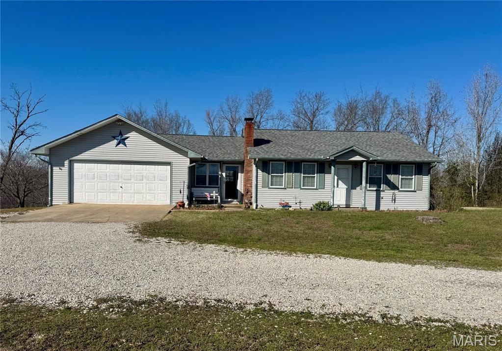 Welcome to peaceful country living at its finest! This beautiful, well maintained home sits on 9.8 mostly wooded acres, offering privacy, space and a serene setting you'll love coming home to. Inside, you'll find 2,328 square feet of finished living space featuring 5 bedrooms and 2 full bathrooms. The home offers an HVAC system along with a cozy wood burning stove, creating comfort and warmth feel. The full finished walkout basement provides excellent additional living space, complete with two bedrooms, a full bath, and a spacious family or entertainment area. This home truly feels warm arm and inviting from the moment you walk in. Step outside to enjoy a well-maintained yard with mature trees and plenty of room for outdoor activities. The beautiful deck leads to a fenced in back yard, making it ideal for children or pets to p pets to play safely.