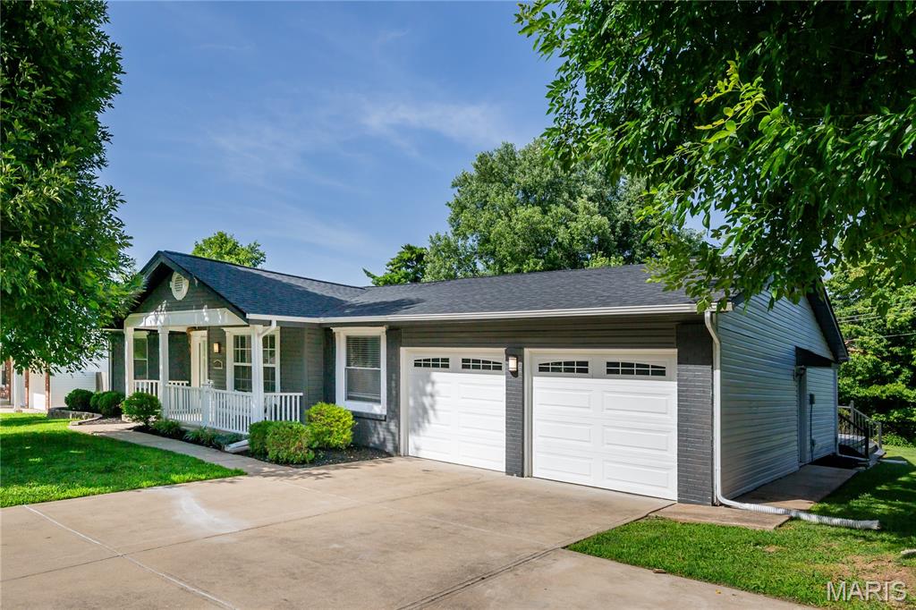 Welcome to this beautifully maintained 3-bedroom, 3-bath home offering approximately 2,258 sq. ft. of above-grade living space plus an additional 1,000 sq. ft. of finished lower-level living space.

Designed for both everyday living and entertaining, this home features spacious, light-filled living areas, a cozy fireplace, and a spectacular sunroom with floor-to-ceiling windows overlooking the peaceful backyard.

Step outside to enjoy a covered porch and a spacious deck featuring a remote-controlled retractable awning for shade and ambient lighting, creating the perfect setting for relaxing evenings or entertaining guests.

Recent updates a brand-new roof.  Two central HVAC systems, and individual mini-split A/C units in each bedroom for personalized comfort. The finished lower level offers flexible space for a family room, recreation area, home office, fitness room, or guest suite.

Additional highlights include a 2-car attached garage with a Tesla EV charging station, as well as heating and air-conditioning vents for year-round comfort, a front-yard irrigation system, and thoughtful updates throughout that make this home truly move-in ready.

Conveniently located near shopping, dining, parks, schools, and major highways, this exceptional home combines space, comfort, and modern convenience. Schedule your private showing today! The St. Louis County Occupancy Inspection has already been completed and passed.