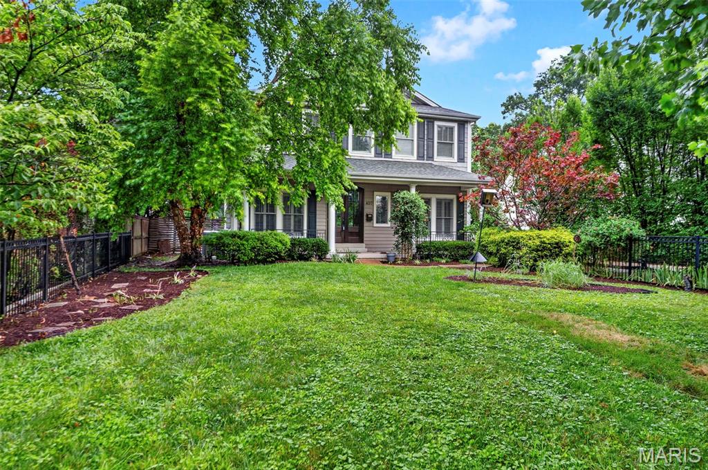 This sophisticated 4,000-square-foot home in the desirable Jefferson-Argonne Historic District of Kirkwood, MO perfectly combines traditional architecture with high-end modern finishes.  It features 4 spacious bedrooms and 3.5 baths above grade, highlighted by a luxurious owner's suite equipped with walk-in closets and premium finishes.  The finished lower level adds approximately 1,300 square feet for exceptional living space and includes a large recreation room, 5th bedroom, and a full bath, perfect for a guest suite or media center.  The elegant main level is defined by rich hardwood flooring, stately arched openings, 3-piece crown molding, and a formal dining room with a detailed coffered ceiling. The spacious owners space upstairs includes a bedroom, sitting room, dressing area, double walk-in closets and a luxurious bath with separate tub and shower.  A 3 car detached garage in back is a rare amenity in Kirkwood and this one features a car charger and a conditioned workshop on top.  This premium location is just down the block from the Farmers Market, OK Hatchery, the train station, and the heart of downtown Kirkwood.