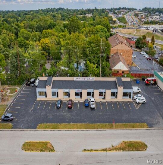 This fully leased multi-tenant retail plaza is a rare opportunity in the highly desirable Saint Charles market. Located along Campus Drive, this established multi-tenant property consists of eight occupied storefronts serving a diverse mix of local businesses, including restaurant, wellness, professional services, chiropractic, beauty, and personal care tenants.
The property generates $103,455 in annual gross rental income and delivers a strong Net Operating Income (NOI) of $75,348, providing investors with immediate cash flow and stable in-place tenancy. Monthly rents include CAM reimbursements, helping support consistent operating performance and expense recovery. 
Strategically positioned in a growing commercial corridor with convenient access to major thoroughfares, the plaza benefits from strong visibility, ample parking, and a tenant roster that serves the surrounding residential and business communities. The diversified tenant mix reduces vacancy risk while creating a dependable income stream for investors seeking a stabilized asset.
Whether you are completing a 1031 exchange, expanding your investment portfolio, or seeking a management-friendly commercial asset, this neighborhood retail center offers an attractive combination of income, stability, and upside potential. Offered For Sale – Contact Listing Agent for Pricing, Financials, and Showing Information.