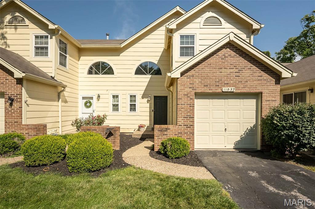 Carefree living is this beautiful, well-maintained, updated townhome, conveniently located near numerous venues. The front courtyard welcomes you with a view of the common area. Inside is an impressive 2-story foyer featuring a sunburst window & open balcony. Newer LVP floors in the foyer, living room with fireplace and attached dining room.  Updated kitchen features white soft close cabinets, granite counter tops, SS appliances with smooth top range, built-in microwave, dishwasher, pantry & access door to your garage for convenience. Newer 16x10 composite deck with view of the open common area. The half bath completes the main level.  Upper level offers new carpeting, large primary suite with vaulted ceiling, ceiling fan, wall of closets & ensuite bath. The ensuite bath has a large vanity with tile shower and linen closet. There is an additional second bedroom and hall bath with hall linen closet. All baths are complete with granite counter tops, soft close cabinets & luxury vinyl. The lower-level walk-out with rough in is great for extra storage, waiting for your finishes, and offers a newer patio. Neutral decor, 6 panel doors, updated lighting, security system and Ring Camera. Amenities include clubhouse, pool, tennis/pickleball/basketball courts and 2 lakes. Short drive to Creve Coeur Park, Maryland Heights Community Center & Aquaport, and Hollywood Casino & Amphitheater. Easy access to I 70, I 270, Historic Downtown St. Charles and Streets of St. Charles. See today!