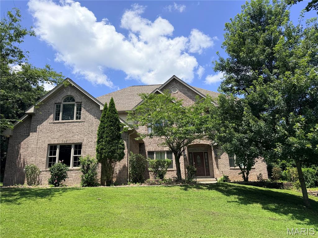 EXCEPTIONAL LUXURY IN SOUGHT-AFTER OAK KNOLL SOUTH!. This impressive all-brick residence offers more than 7,000 sq ft of beautifully designed living space, combining timeless elegance with everyday comfort.  Featuring six generously sized bedrooms (some non conforming)  and 4.5 baths, this home was thoughtfully crafted with quality finishes and room for everyone.  Step inside to soaring ceilings, rich hardwood flooring, and an inviting open-concept layout ideal for both entertaining and daily living.  the chef-inspired kitchen is the centerpiece of the home, showcasing granite countertops, stainless steel appliances, abundant cabinetry, and a seamless flow into the spacious living areas.  The main level primary suite provides a private retreat with ample space, over-sized walk in closets, and a luxurious en suite bath complete with dual vanities, a soaking tub, and a separate walk-in shower.  Upstairs, you will find four additional bedrooms, offering flexibility for family, guests, or home office spaces.  The finished walk-out lower level expands your living options with a large family room, dedicated theatre room, additional bedrooms and bath plus plenty of storage.  Outdoor living is just as impressive, featuring a multi-level deck overlooking the backyard-perfect for grilling, entertaining, or simply unwinding after a long day.  Ideally located in the desirable Oak Knoll South subdivision, this remarkable property offers convenient access to walking trails, shopping, dining, schools, and everything Rolla has to offer.  A rare opportunity to own a home of this size, quality, and location!