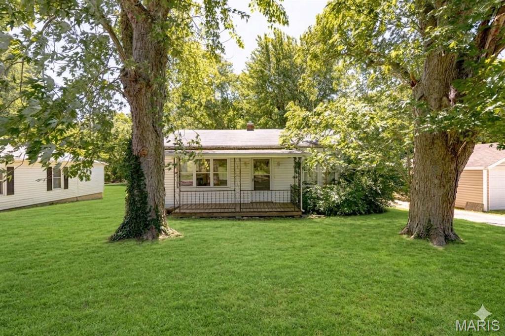 Great opportunity for a first-time homebuyer! This home features spacious rooms, 2 bed/1 bath, easy access, and a level lot complete with a functional outbuilding. The short-wall basement provides the perfect setup for extra storage. Bring your updates and design ideas to make this property truly shine.