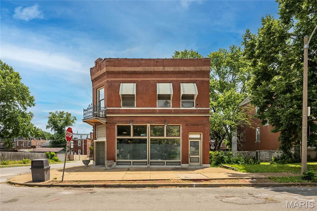 Exceptional opportunity in one of St. Louis' most vibrant historic neighborhoods. This iconic 1896 corner building offers approximately 3,960 square feet of space, presenting endless possibilities for investors, developers, entrepreneurs, or owner-users. The property features classic historic architecture with generous interior square footage, high ceilings, and a highly visible corner location ideal for commercial, mixed-use, creative office, retail, hospitality, or residential conversion (subject to zoning and approvals). Whether you're looking to restore a historic landmark, create loft-style residences, establish a destination business, or develop a unique live/work concept, this property provides the scale and character to bring your vision to life. Situated near thriving dining, arts, and entertainment district, with convenient access to downtown St. Louis, major highways, and surrounding neighborhoods, the location offers strong long-term investment potential. Bring your vision and unlock the possibilities this historic property has to offer. Property is being sold as-is. Buyers are encouraged to verify zoning, permitted uses, square footage, and redevelopment opportunities. Owner had a thriving grocery business for over 50 years in the first floor.  The 2nd floor apartment has been vacant for 30+ years and was used for storage.