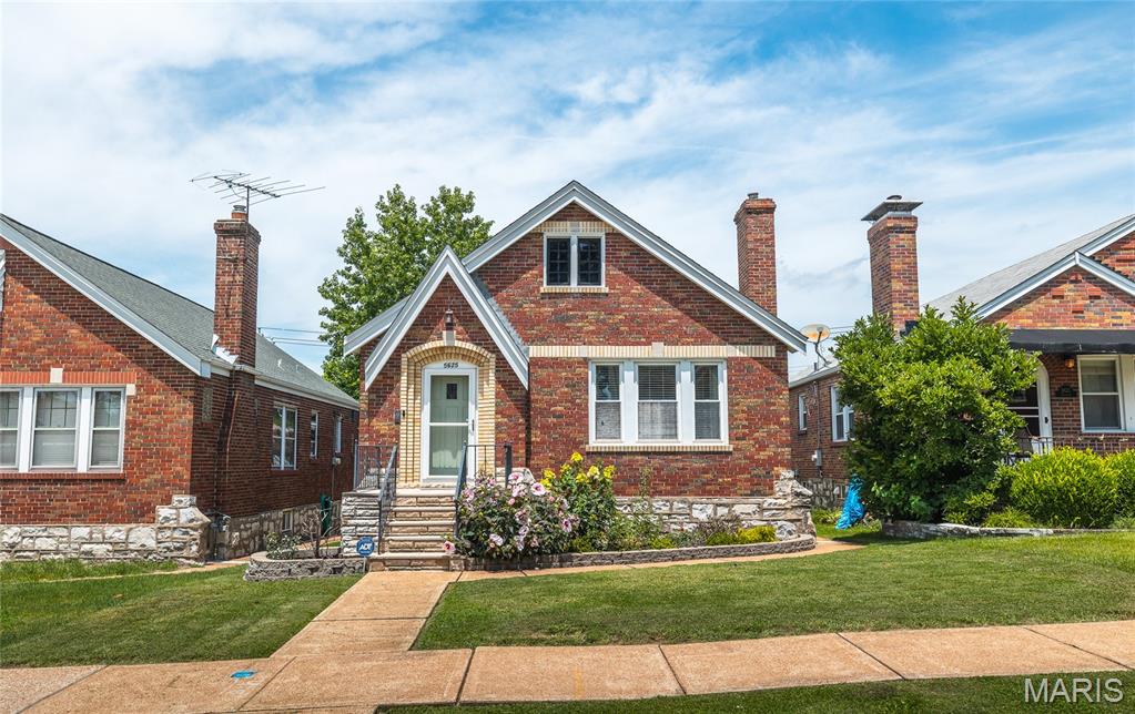 Classic St. Louis charm meets modern updates in this inviting 2-bedroom, 1-bath gingerbread bungalow in the sought-after North Hampton neighborhood. From its timeless brick exterior and welcoming curb appeal to the bright, comfortable interior, this home is full of character. Step inside to discover beautiful hardwood floors, abundant natural light, and a spacious living room that flows seamlessly into the dedicated dining area—perfect for everyday living and entertaining. The updated eat-in kitchen features granite countertops, shaker-style cabinetry with crown molding, stainless steel appliances, and plenty of space to gather. Two generously sized bedrooms and a tastefully updated full bath complete the main level. Downstairs, the lower level offers endless possibilities with plenty of storage, a built-in bar, and flexible space for a rec room, home gym, or game-day retreat. Out back, you'll find a private, fully fenced yard designed for relaxing and entertaining, complete with a large deck and ample green space for pets, play, or gardening. Conveniently located near parks, local restaurants, shopping, and everything South City has to offer, this move-in-ready bungalow is one you won't want to miss!