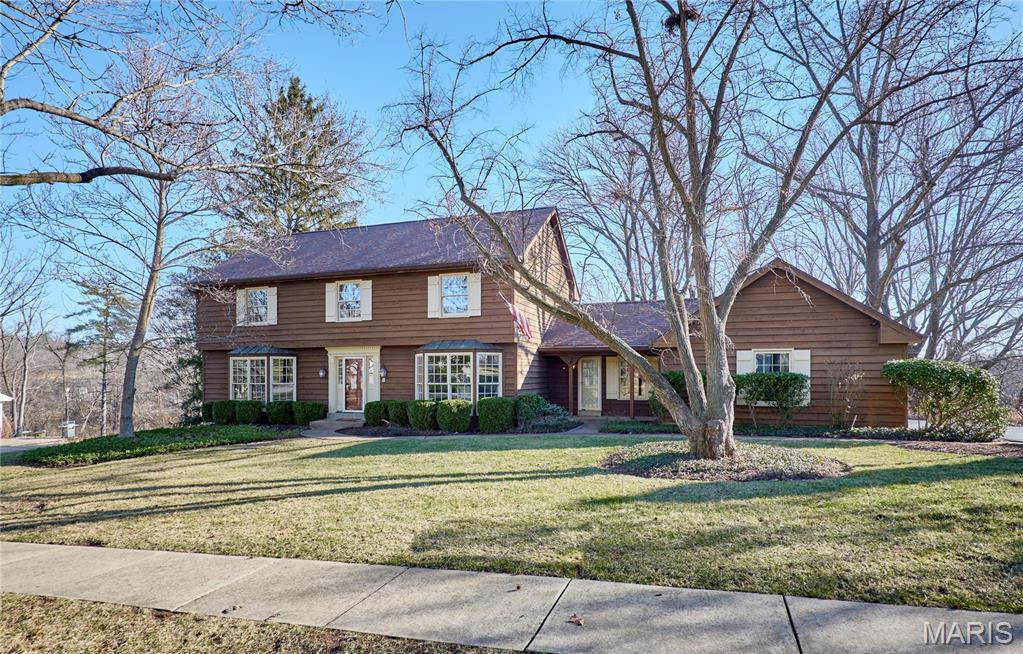 Set in the heart of Town & Country, this inviting residence offers a rare blend of privacy, space and location. Backing to 14 acres of protected common ground, enjoy a tranquil, private setting while remaining just minutes from the area’s most sought-after amenities. The thoughtfully designed floor plan features four spacious bedrooms and 3.5 bathrooms, with gracious living spaces ideal for both everyday living and accommodating guests. Upon entry, the formal dining room and generous living room set the tone, enhanced by bay windows that flood the home with natural light. The kitchen serves as a warm gathering place, where family and friends can enjoy the stone fireplace, peaceful views of the private backyard, and the soothing sounds of the outdoor pond with gentle waterfall. An expansive four seasons room with a wall of windows overlooks the pool and beautifully landscaped, tree lined yard, connecting to the outdoors for year round enjoyment. The primary suite is a true private retreat, offering generous proportions and a calming atmosphere. The primary includes two closets, one a custom walk in just across from the ensuite that includes a jacuzzi soaking tub, double vanity, and private shower.  The lower level adds distinctive character, featuring architectural accents inspired by iconic St. Louis venues, including lighting from the Fox Theatre and stain glass from famous stables, creating a space that is both charming and truly one of a kind. A sunlit corner of the lower level that looks out onto the pool is an ideal spot for a home office or craft area. Located within the top-rated Parkway School District, the neighborhood is within walking distance of Queeny Park and just minutes from premier shopping, dining, golf courses, and cultural destinations.