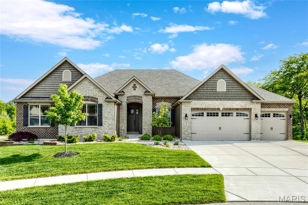 Exceptional brick & stone great room ranch from award-winning Lombardo Homes. This custom-built contemporary features sophisticated interior detailing & premium builder upgrades throughout including porcelain tile flooring, 11’ ceilings & full-height windows with transoms. Impressive covered porch entrance with 8’ front door leads to tiled foyer, formal dining room with tray ceiling and stunning great room with linear fireplace flanked by open shelving & built-in storage cabinets. The main living area unfolds into the designer kitchen featuring glazed maple Shaker cabinetry, double stacked mitered Cambria quartz countertops, KitchenAid appliances, 10’ center island with waterfall edges & butler’s pantry and light-filled breakfast room with sliding glass door that opens to deck. Primary bedroom suite with 2 customized walk-in closets, wide bay window & expansive bath with walk-through shower &freestanding tub offers an appealing retreat. 2 Additional bedrooms & hall full bath complete the main floor living quarters. Open staircase accesses Lower Level entertainment space with recreation room &gathering bar plus office, 4th bedroom & full bath. Situated on a premium lot at the end of the cul-de-sac with covered deck, aggregate patio & oversized 3-car garage