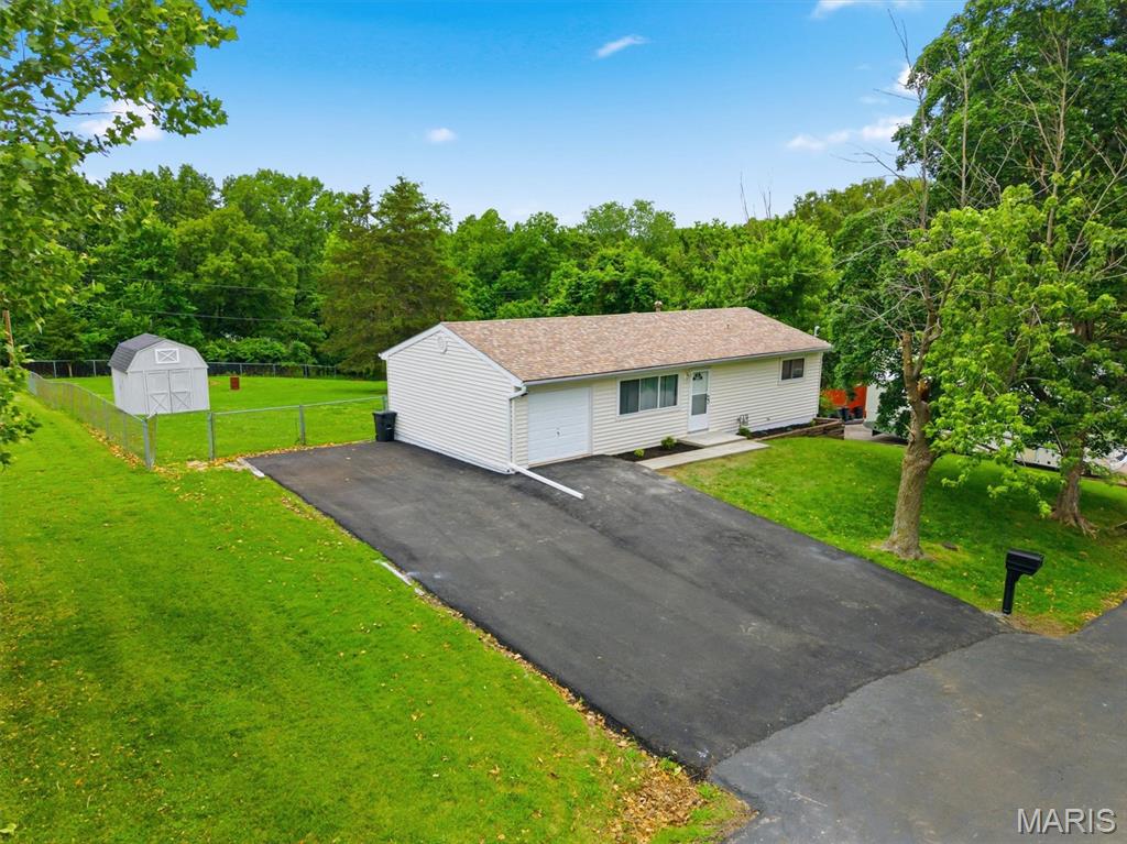 HUGE LOT! You must see this well done, nicely updated home.  The brand-new kitchen will impress anyone you show!  This property has been freshly painted, new flooring installed throughout, and updated bathroom.  A new electric panel and meter was installed too!  The double driveway just has asphalt poured and plenty of space for your vehicles! This is a very clean home and well maintained.  It's tough to find a home with such a big yard!