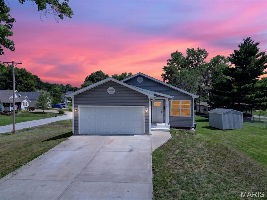 Welcome to this beautifully designed ranch home offering modern comfort, thoughtful finishes, and room to grow! The open-concept floor plan creates an inviting space where the kitchen flows effortlessly into the main living area, making everyday living and entertaining a breeze. The kitchen features granite countertops, 42-inch soft-close cabinetry, a deep undermount sink, and abundant workspace.

The spacious primary suite includes a private ensuite bath, while convenient main-floor laundry adds to the home's practical design. Durable laminate flooring extends throughout the main living areas, with ceramic tile in both bathrooms for easy maintenance and timeless appeal.

The unfinished lower level offers endless possibilities with a full bath rough-in, oversized windows that provide natural light, and ample space to customize for additional living areas, a recreation room, home office, or workshop.

Outside, the backyard is ready for your personal touch, providing plenty of room to create the outdoor retreat you've always envisioned. Ideally located near schools, shopping, dining, and everyday conveniences, this move-in-ready home combines quality finishes, functionality, and future potential—all in one exceptional package.
Come visit this charmer in the heart of Warrenton,MO.