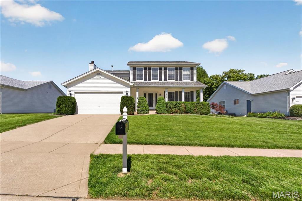 This beautiful 4-bedroom, 4-bath two-story home offers the space, layout, and location buyers are looking for.  Large windows bring in natural light throughout the main level, which includes a living room, separate dining room, half bath and family room complete with a wood burning fireplace.The updated kitchen features solid surface countertops, center island, stainless steel appliances, an eat-in breakfast area and walks directly out to the large deck. Upstairs you’ll find the primary suite along with 3 generous sized bedrooms and plenty of closet space. Additional features include an attached 2 car garage and a finished walkout lower level, adding even more room to spread out with a gas fireplace and access to a back patio and large backyard.  Located near Highways 364 and 94 and within the Francis Howell School District, this home offers convenient access to shopping, restaurants, parks, and more.