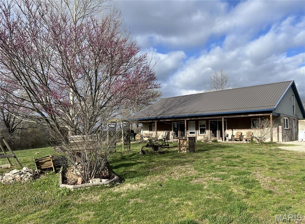 This is a rare opportunity to own a uniquely secluded country property on approximately 21 acres on C.R. 219E just North of Bloomfield. This 1-story bermed home was designed with efficiency and comfort in mind and features an outdoor boiler system with ducted radiant heat, creating cozy warmth throughout the home while helping maximize energy efficiency.

The home offers convenient main-level living plus an unfinished upper level already in place that could easily be finished into additional bedrooms, living areas, office space, or a recreational room — giving buyers the opportunity to expand and customize to fit their needs.

One of the standout features of this property is the impressive 2,016 sq ft barn built in 2015, complete with its own kitchen area, making it ideal for entertaining, gatherings, hobbies, workshops, etc.... The possibilities for this space are truly endless.

Surrounded by open acreage, mature trees, and peaceful views, this property is perfect for those looking for a hobby farm, hunting retreat, horse property, or simply room to enjoy the outdoors and country lifestyle. If you’ve been dreaming of privacy, functionality, and endless potential, this one is a must-see!