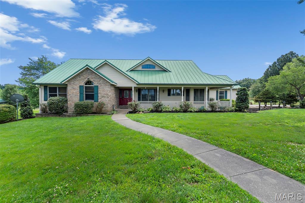 An absolutely beautiful home with over 4,300 square feet of finished space on a ready-for-horses 6.06 acres. This stunning ranch home offers an open floor plan with soaring ceilings, 4 bedrooms, and 3.5 bathrooms. Two gas fireplaces—located on the main level and in the finished lower level. Laundry rooms on both levels provide added convenience for everyday living. The beautifully updated kitchen features granite countertops and custom glazed cabinetry by Beussink, making it a standout gathering space. Enjoy peaceful views from the stunning sunroom or relax on the composite deck overlooking the large patio and pasture. The acreage is dotted with mature trees and includes three large shops, one specifically designed to accommodate an RV. Combining generous living space, quality updates, outstanding outbuildings, all in an awesome location, this property offers a rare opportunity to enjoy the best of country living. (Pictures coming 6/12, live for showings 6/15)