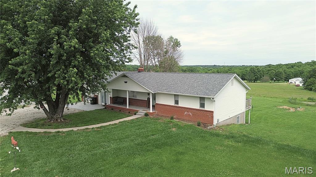 Ranch home on 5 acres in New Bloomfield Schools offering 3 beds, 2 full baths, and 1,908 sq ft on the main level. Features a new kitchen with updated cabinets, countertops, and appliances, plus fresh paint, LVP flooring, and new carpet throughout. Main level includes a living room with fireplace, formal dining, mudroom, and 3-season room. Walk-out basement offers space for a future family room and includes a John Deere room. Attached 1-car garage plus outbuildings: 18x20 carport, 24x30 garage with lean-to, and 30x24 shed with 24x48 lean-to. Ideal for horses, hobbies, or workshop use.