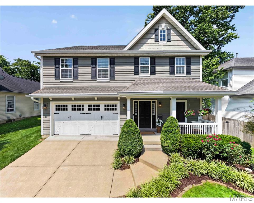 Amazing opportunity to own a Newer home on one of Kirkwood’s most desirable streets! All the conveniences of Modern construction without the wait time of a new build.  This move in ready Home features approx 4,000 sq ft of total living space. Welcoming front porch walks into Entry way with warm wood floors that run throughout main level. Separate Dining Room with wainscoting opens to Family Room with gas fireplace, recessed lighting, and built in speakers. Dream Kitchen with center island, granite tops, ceramic tile backsplash, and  stainless steel appliances including gas range. Cozy Breakfast Room with pantry walks out to large patio with custom pavers and Covered Porch with tongue and groove ceiling and outdoor lighting.  Patio is great place to BBQ while the kids play in the nice sized, level yard. Covered porch is perfect for watching the game in the shade while enjoying a beverage. Entire outdoor space is bordered by retaining wall. Decorative railing with wrought iron leads upstairs to 4 bedrooms including spacious primary bed with coffered ceiling and two walk in closets. Primary bath with separate his & her vanities, built in tub, and floor to ceiling tile shower w/ glass door. Ample sized Beds #2 and #3 share jack-n-Jill bath which is ideal for the growing family. 4th bed is being utilized as work from home office. All beds with walk in closets. Awesome lower level with custom tile flooring also features Large Rec Room, full kitchen, and Full bath!  LL Kitchen with stainless steel beverage center, dishwasher, and fridge. Granite top island with stone accents and stools is perfect gathering place for friends. Huge Rec Room area to hang out and watch the game or let the kids play. All of this plus drywalled 2 car garage, Convenient Upstairs Laundry, 5 panel doors, and in ground sprinklers!  Walkable to all things Kirkwood including sought after Keysor Elementary and Kirkwood Park.  Modern Construction on a Great Street Surrounded by other new builds.  Turnkey Two Story in Prime Kirkwood Location!