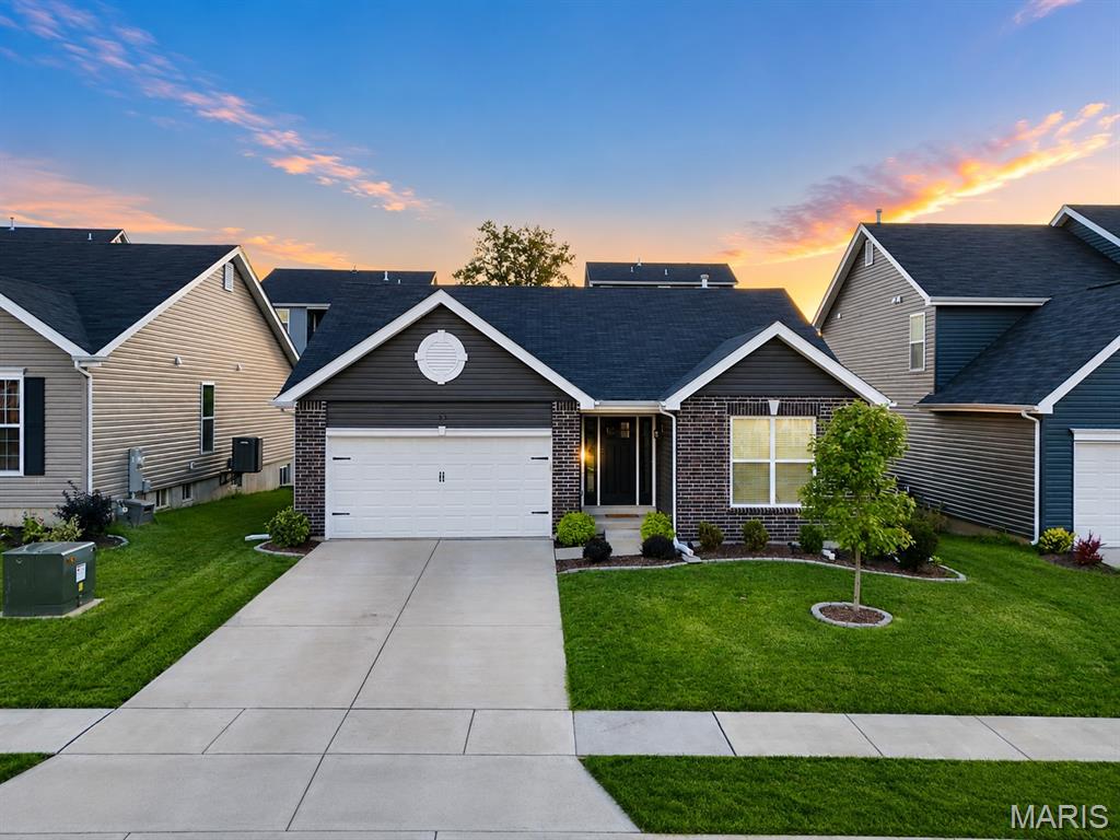 Welcome home to a beautifully designed ranch where bright open living spaces, quality finishes, and thoughtful details come together to create a home that's as comfortable as it is beautiful. Bathed in natural light, the open-concept floor plan is ideal for both everyday living and effortless entertaining, with luxury vinyl flooring flowing throughout the main living areas and creating a warm, inviting atmosphere. The stylish kitchen is the heart of the home, featuring crisp white cabinetry, stainless steel appliances, abundant counter space, and seamless connection to the dining and living areas, making gathering with family and friends a breeze. Escape to the spacious primary suite, complete with a generous walk-in closet and private ensuite featuring a double vanity and oversized shower. Two additional bedrooms and a second full bath offer flexibility for family, guests, or a dedicated home office. A convenient main-floor laundry room and attached two-car garage add everyday functionality, while the full unfinished basement provides endless possibilities for future living space, a recreation room, a home gym, or abundant storage. Outside, enjoy a beautifully landscaped, level backyard with plenty of room to relax, entertain, or create your own outdoor retreat. Just around the corner, the neighborhood park provides a wonderful extension of your backyard, offering plenty of space for children to play, pets to roam, and neighbors to gather. With easy access to major commuter routes, this exceptional home offers the perfect combination of modern comfort, timeless style, and move-in-ready living.