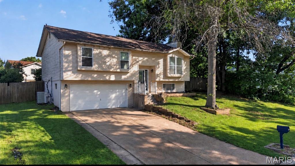 More than just a place to live, this is a home designed to keep up with everyday life. Located in the Shenandoah Park neighborhood, this 3-bedroom, 2.5 bathroom split-level offers the space and layout buyers love. The spacious kitchen with  center island opens to the main living area, creating a natural hub for everything from busy weekday mornings to holiday celebrations. The lower level adds valuable living space with a cozy fireplace and room to spread out, work from home, entertain, or relax. Outside, a large patio and pergola create the perfect backdrop for backyard barbecues, morning coffee, and evenings spent with family and friends. With multiple living areas and inviting indoor-outdoor spaces, this home offers comfort, flexibility, and room to make lasting memories. Conveniently located near parks, shopping, dining, and more. A great opportunity to make this home your own in a fantastic St. Charles location