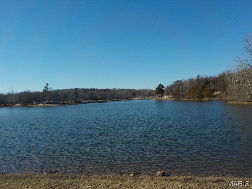 Double level lot in Rouge Creek valley   Build you personal home which could be a mfg home.  Lots are mostly wooded and level.  Lake access to 3 ponds/ lakes.   Gated community    Looking for that get away place?