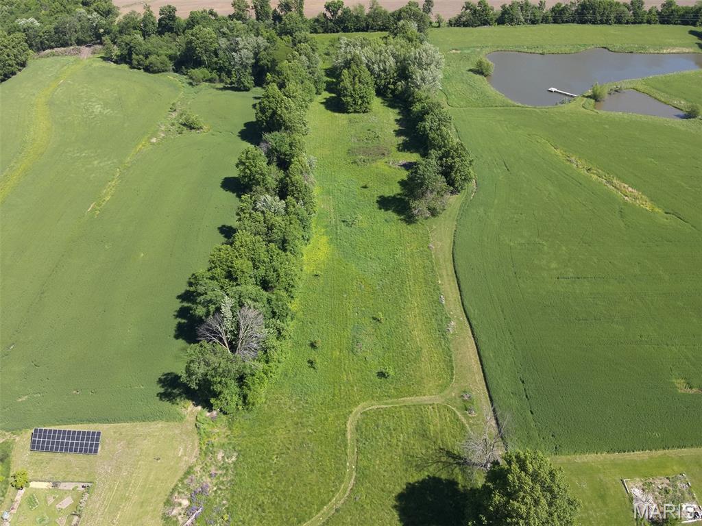 Nestled in the city limits of Perry, Missouri, this rare 5.66 -acre property offers the perfect blend of privacy, convenience, and endless potential. Properties like this are nearly impossible to find — acreage with blacktop road access, utilities nearby, and the peaceful country feel everyone is searching for. Whether you're looking to build your forever home, create the perfect weekend getaway, or establish a private camping or RV retreat, this property checks all the boxes.

Don’t let the narrow entrance fool you — the property opens up with plenty of usable space for a home, garage, shed, RV site, outdoor entertaining area, and more. With no current driveway in place, you have the freedom to design your own ideal entrance.

Enjoy the quiet, secluded atmosphere while still benefiting from the convenience of being inside city limits. Located just a short drive from the beautiful Mark Twain Lake, you’ll have easy access to boating, fishing, camping, hunting, beaches, and year-round outdoor recreation. Nearby amenities include restaurants, shopping, marinas, parks, and small-town conveniences, making this an ideal property for full-time living or weekend escapes.

*Agent Owned