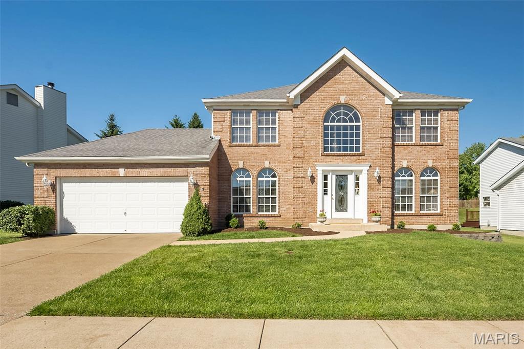 Classic-styled brick 2 Sty in premier Wildwood location with award-winning Rockwood schools. Center hall floor plan features light-filled rooms with oak hardwoods, newly installed carpeting, freshly painted interiors & palladian windows. Impressive 2-sty foyer leads to formal living & dining rooms with detailed trim work and spacious family room with bank of windows & marble fireplace. Chef’s kitchen with maple cabinetry, stainless steel appliances, 5’ center island & convenient planning center adjoins vaulted breakfast room with atrium door that opens to patio. The primary bedroom suite with luxury bath provides an appealing retreat. 3 Additional bedrooms & hall full bath complete the 2nd floor living quarters. Lower Level entertainment space includes recreation room, game room, family room with built-in bookcase & full bath. Take advantage of this opportunity to live within walking distance of trails, shopping, dining & Wildwood Town Center.