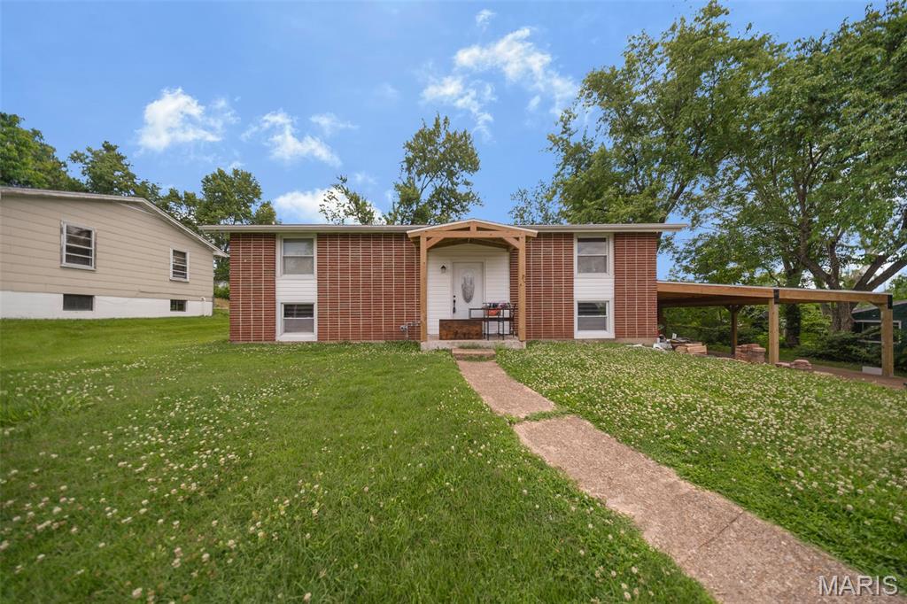 Welcome to this charming 3-bedroom, 1.5-bath split foyer home in the heart of Rolla! Featuring numerous recent updates, this move-in ready property offers a perfect blend of comfort and convenience. The spacious interior includes an inviting living area and a primary bedroom highlighted by a cozy electric fireplace, creating the perfect retreat at the end of the day. Recent improvements include a new roof, new siding, new appliances, and a large new carport, providing both style and peace of mind. Outside, you'll find an outdoor storage shed for all your tools and equipment, plus plenty of space to enjoy. Conveniently located near schools, shopping, dining, and everyday amenities, this home is a must-see.