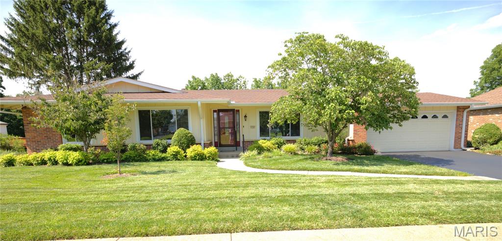 Welcome home to move-in ready comfort and style in this beautifully updated ranch located in the highly sought-after Queen Anne Village subdivision in Pattonville School District! Offering an approximately 2,500+ sq ft of total living space, this single-level living, 3-bed, 3-bath home welcomes you with an open and inviting floorplan filled with natural light and rich finishes throughout. The modern kitchen serves as the heart of the home, featuring custom cabinetry, stone countertops, well-lit breakfast room and seamless flow into the dining and living areas. Vaulted ceilings in the great room enhance the sense of space, while the primary suite provides a comfortable and private retreat. Two additional main floor bedrooms offer flexibility for guests, a home office, or growing needs. Enjoy the convenience of main-floor laundry (modern washer/dryer included) and head downstairs to a partially finished basement, ideal for a rec room, workout space, or additional living area, with 2 large bonus rooms, a full bath, and plenty of storage still available. All home systems have been updated by current owner. Step outside to a beautifully landscaped, private backyard that is highlighted by a beautiful view of the private lake and wooded area, with ample area for back yard recreation. On a quiet street, just a short walk to St. Louis JCC and Willow Brook Elementary, and conveniently located near shopping, dining, and major highways, this home also includes a 2-car garage and blends comfort, style, and everyday functionality in an unbeatable location.