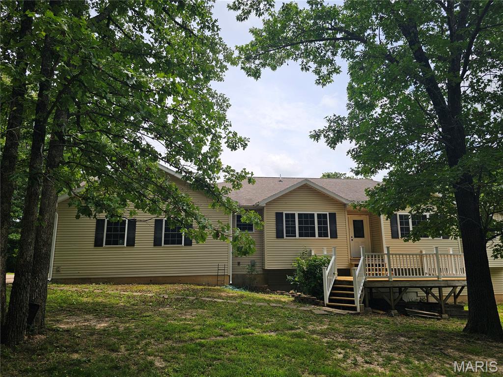 LARGE COUNTRY HOME FOR SALE NEAR CROCKER, in PULASKI COUNTY MISSOURI. 5 Bed 3.5 Bath with raised and cathedral ceilings in multiple Living Areas, Spacious Kitchen with Wine Rack and Stainless Appliances. The Full, Finished Basement includes double size bedroom and a John Deere Room or area for Work Shop. Master Bath has a newly remodeled shower and a unique Jetted Tub. The Back Yard Pool adds a little Luxury to the Country Lifestyle, while a Back-up Generator System provides security and Peace of Mind. For the Wildlife Lovers, the Wooded Acreage surrounding the Home is Habitat for a variety of Critters to watch. Towards the back of the property is a nice pond, suitable for possible fishing. The peace and quiet of the Rural Lifestyle close to a Country Town awaits you here....Come On By!!