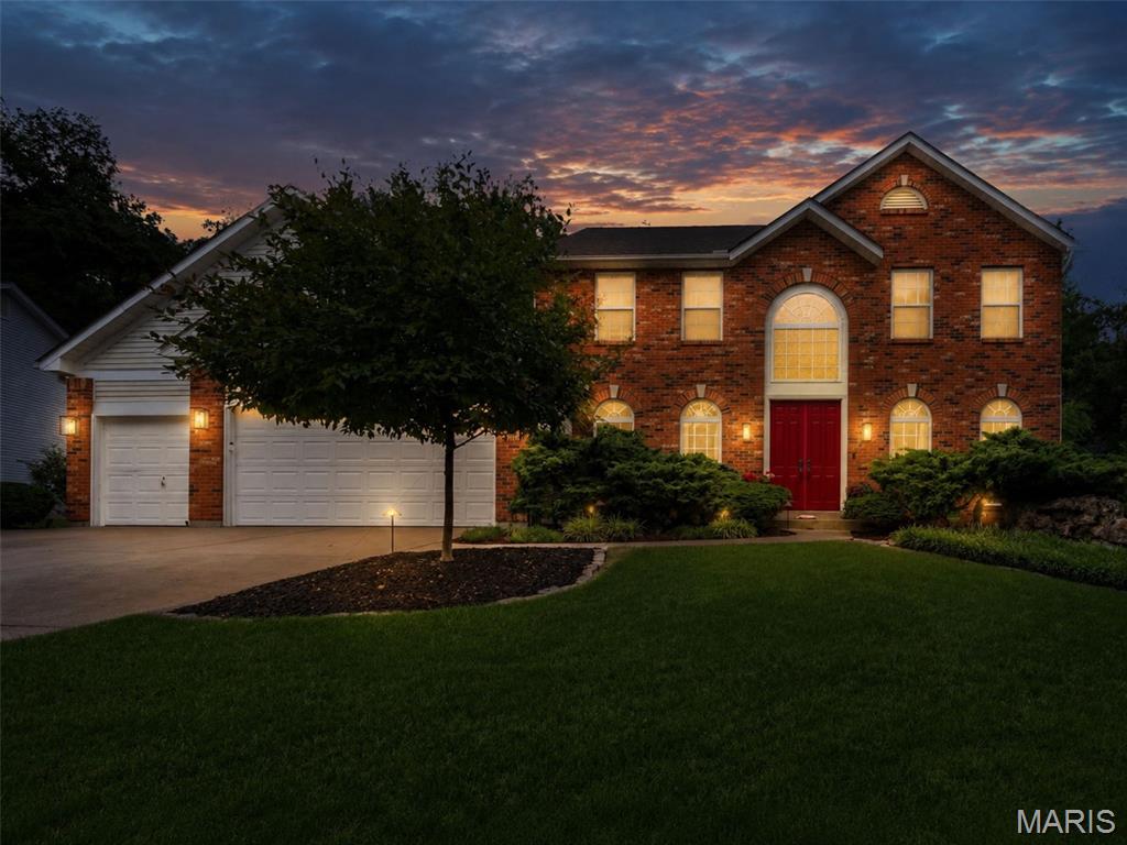 Welcome to this stunning 4-bedroom, 3.5-bath traditional home nestled on a private .38-acre wooded lot in desirable Dardenne Prairie! A dramatic 2-story entrance foyer sets the tone for the open, airy floorplan with an effortless flow. A formal living room (or office) sits in the front of the home and on the other side of the elegant stairs is the formal dining room with an impressive trayed ceiling. 

Gather around the gas log fireplace, flanked with built-in bookshelves in the huge family room with crown molding. The family room is open to the breakfast nook and updated kitchen. It shines with stainless steel appliances and center island - great layout for entertaining, with access to the spacious paver patio where you can enjoy the peaceful, park-like, wooded surroundings. A laundry room, dedicated storage room, and powder room complete the main level. 

Upstairs, the generous owner's suite has a trayed ceiling and walk-in closets. The bathroom has separate vanities—providing plenty of room to get ready, jetted tub, separate shower, and a skylight. Three more bedrooms, one with French doors, plus another full bathroom round out the second floor. 

The partially finished basement offers an incredible rec room with wet bar, + office, full bath, and storage. A  3-car attached garage completes this exceptional home that checks every box. Just 1 mile (10 minute walk) to Barathaven Park with 15 acre lake and 3 miles of trails and minutes to HWY 64 for easy commuting. Don't miss your opportunity to own this Dardenne Prairie gem in the Francis Howell school district!