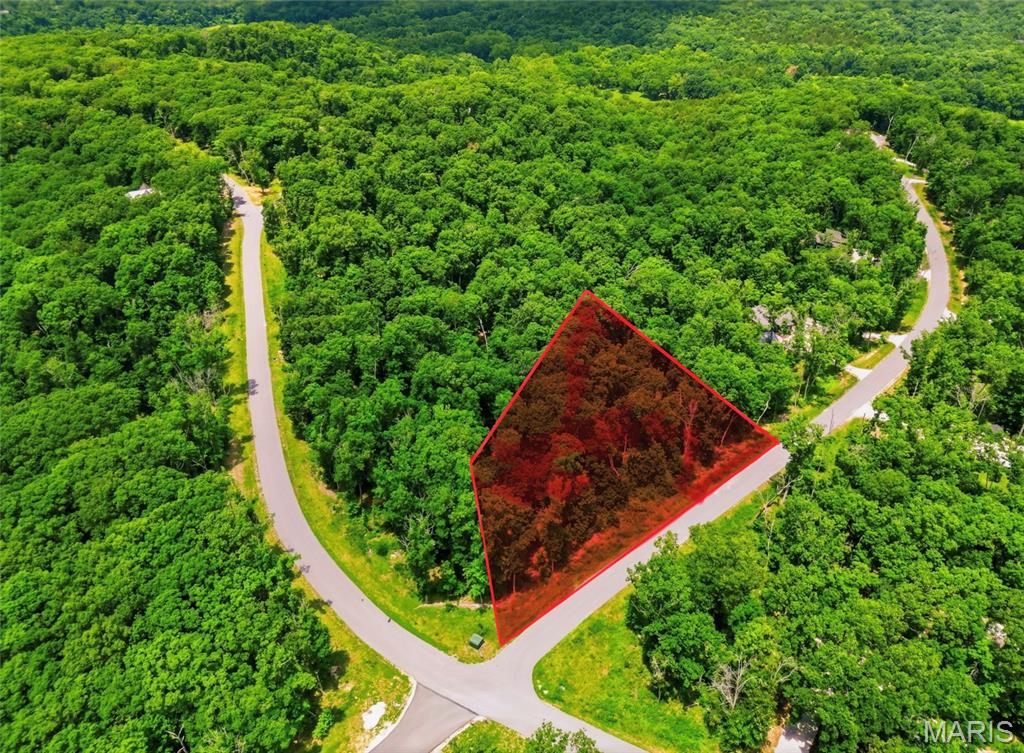 Build your dream treehouse retreat on this scenic 2.03-acre lot surrounded by mature hardwoods and beautiful natural views. Elevated above the forest floor, this property offers the perfect setting to build one of Innsbrook’s signature treehouse concepts, your own private hideaway immersed in nature.
Located in the desirable Tyrolean region of Innsbrook — a gated area with its own private entrance — you’ll enjoy convenient access to multiple lakes, the Tyrolean Nature Trail, and nearby Charrette Commons, featuring an outdoor pool, restaurant, fitness center, outdoor amphitheater, playground, and pickleball courts. Whether you’re seeking a full-time residence or a relaxing weekend escape, this peaceful wooded homesite offers privacy, recreation, and endless possibilities.