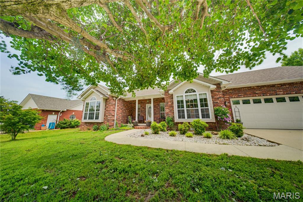 Welcome home to this beautifully maintained ranch-style retreat, where comfort, charm and functionality come together perfectly.  This attractive brick and vinyl home offers a warm and inviting presence beginning with the welcoming covered front porch-the perfect place to enjoy quiet mornings or relax in the evening breeze.
Step inside to a spacious foyer that open into a flowing open-concept floor plan designed for boh everyday living and effortless entertaining.  The nicely designed kitchen offers an easy-to-work-in layout with abundant workspace, making meal preparation both convenient and enjoyable while remaining open to the main living areas.
This comfortable home features three spacious bedrooms and two full bathrooms, including a generous primary suite designed with relaxation in mind. The primary bedroom offers private access to the back deck, creating a peaceful retreat for morning coffee or evening unwinding.  The large primary bath includes double sinks, a soothing garden tub, separate shower, and an oversized walk-in closet for exceptional storage and convenience.
Situated in a popular subdivision on a desirable double corner lot, the property provides extra outdoor space with lovely garden features that enhance the home's inviting atmosphere.  Thoughtfully cared for and well maintained throughout, this home combines practicality with timeless appeal, offering the perfect setting for comfortable family living and gracious entertaining.
Call today for your private viewing.