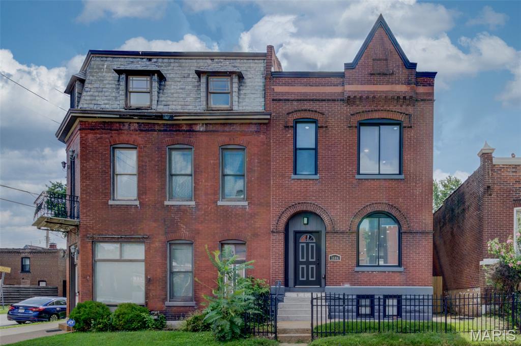 Step into the perfect blend of historic charm and modern luxury in this beautifully restored home originally built in 1892. Completely renovated from top to bottom, this one-of-a-kind residence offers today's most sought-after finishes while preserving the character of its original architecture. Several of the bedrooms feature their own private balcony, creating a unique retreat rarely found in city living. The thoughtfully designed floor plan includes a convenient second-floor laundry room, stylish kitchen with modern finishes, and updated systems throughout. Outside, enjoy the convenience of a newly constructed detached 2 car garage — a true luxury in the city. This is historic living without the historic headaches.