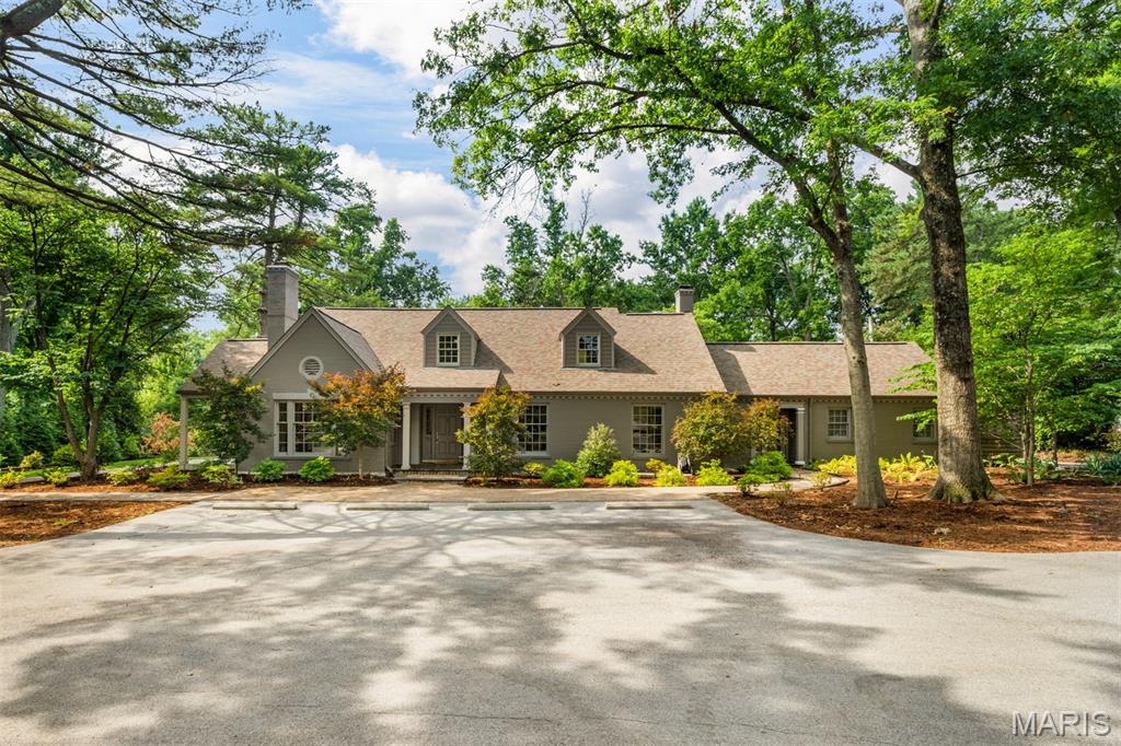 Showings begin 7/14/2026 -Wonderful opportunity to live in your dream home on a wooded lot in Frontenac. Enjoy unlimited entertaining opportunities both inside and out.  Grand entry, library, expansive kitchen and family room that both connect to a sun room with views of the manicured back yard perfect for summer gatherings. Upstairs the large primary bedroom addition with spa like bathroom and kitchenette make this a cozy private hideaway.  At the heart of the home is a stunning expanded kitchen featuring generous workspace, a walk-in pantry, a large eat in space that flows to the surrounding gathering areas. Upstairs, hardwood flooring extends throughout all bedrooms and hallways, complemented by renovated baths and large bedrooms.  The basement awaits your finishing touches,  kitchen space, bath, office or craft space, large laundry room and possible family room. Designed for year-round enjoyment, the backyard offers a true resort-like setting. Multiple seating areas, dining areas and mature landscaping for seasonal interest.  Showings to begin 7/14/26.